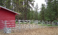 A heavy duty 5 rail pipe corral for a horse